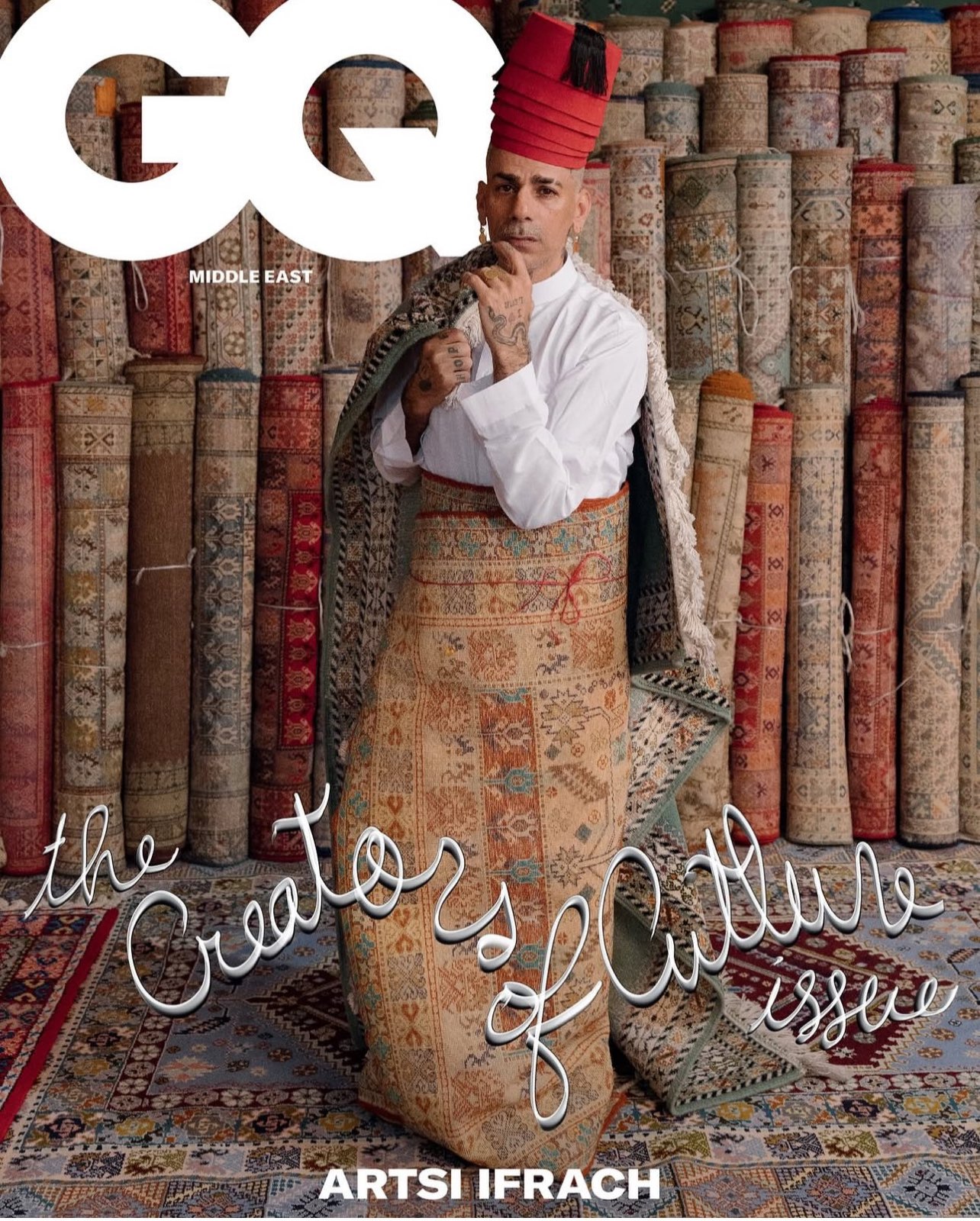 Artsi Ifrach on the cover of GQ Middle East, the Creators of Culture issue, wrapped in an antique Moroccan rug.